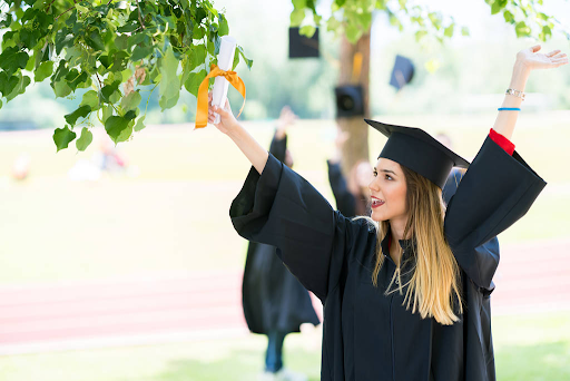 This is an image of a woman who is happy because she has just graduated and received her certificate.