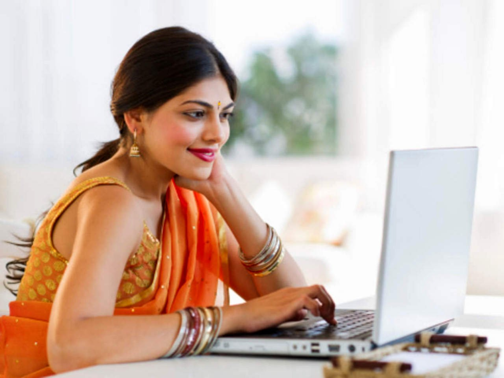 A woman looking at her laptop image