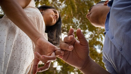 A couple holding hands showcasing Trust and authenticity.