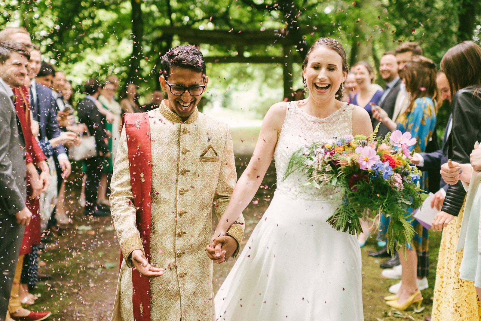 A happy married couple from two different backgrounds image.