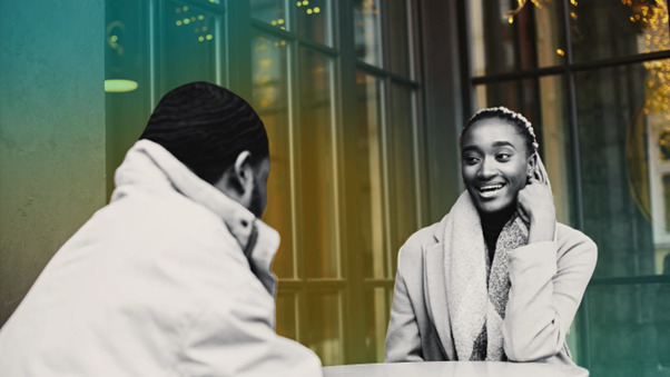 A couple sitting in a cafe having a conversation and getting to know about each other image